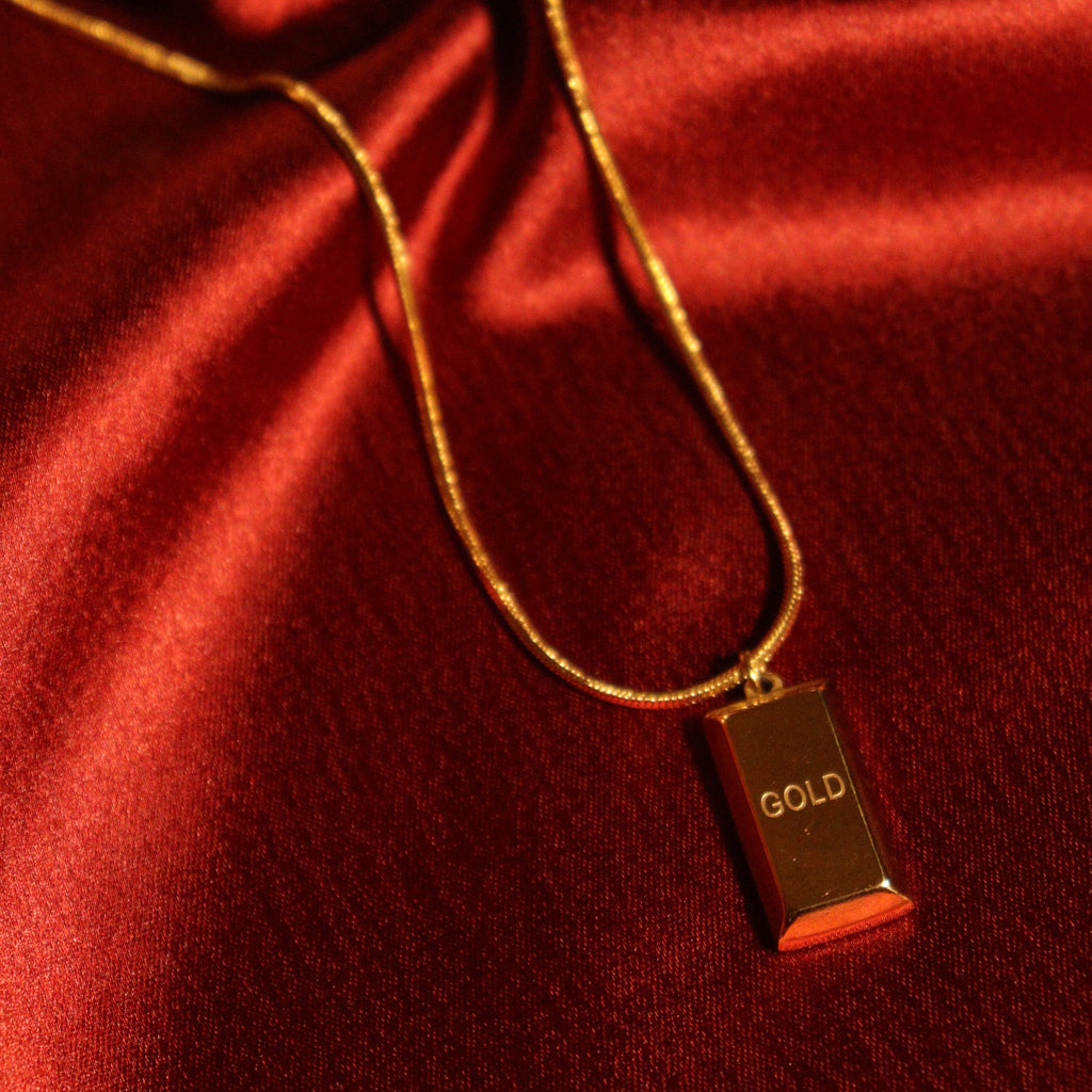 Gold biscuit pendant