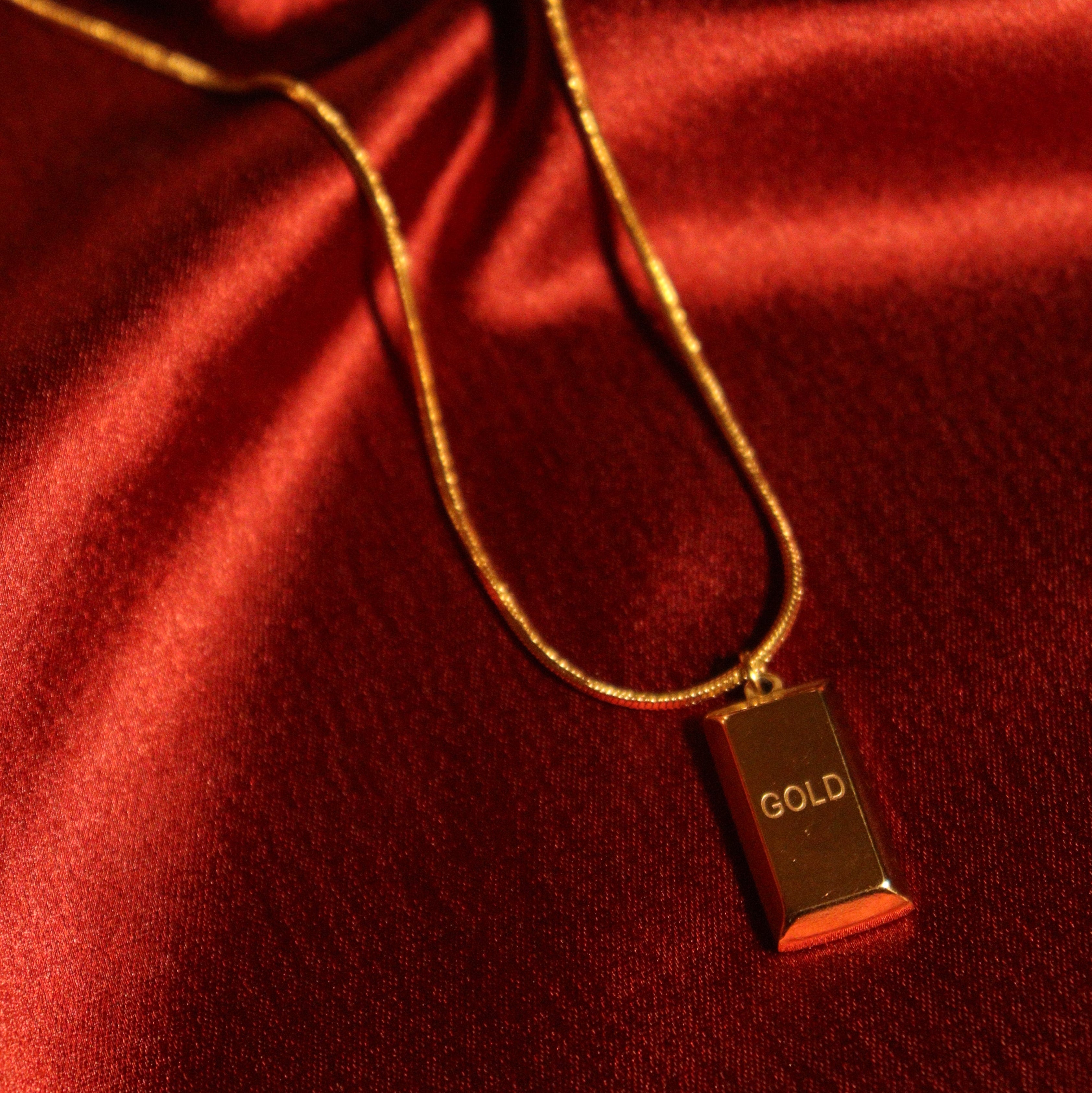 Gold biscuit pendant