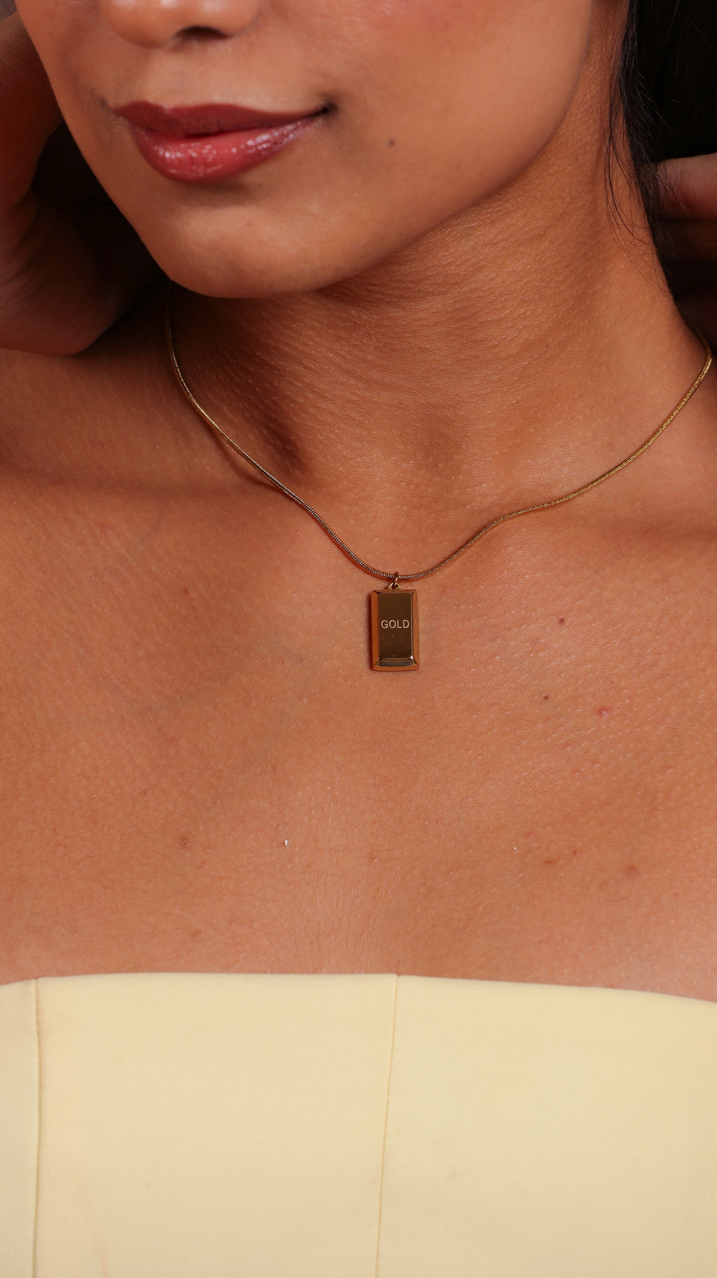 Gold biscuit pendant