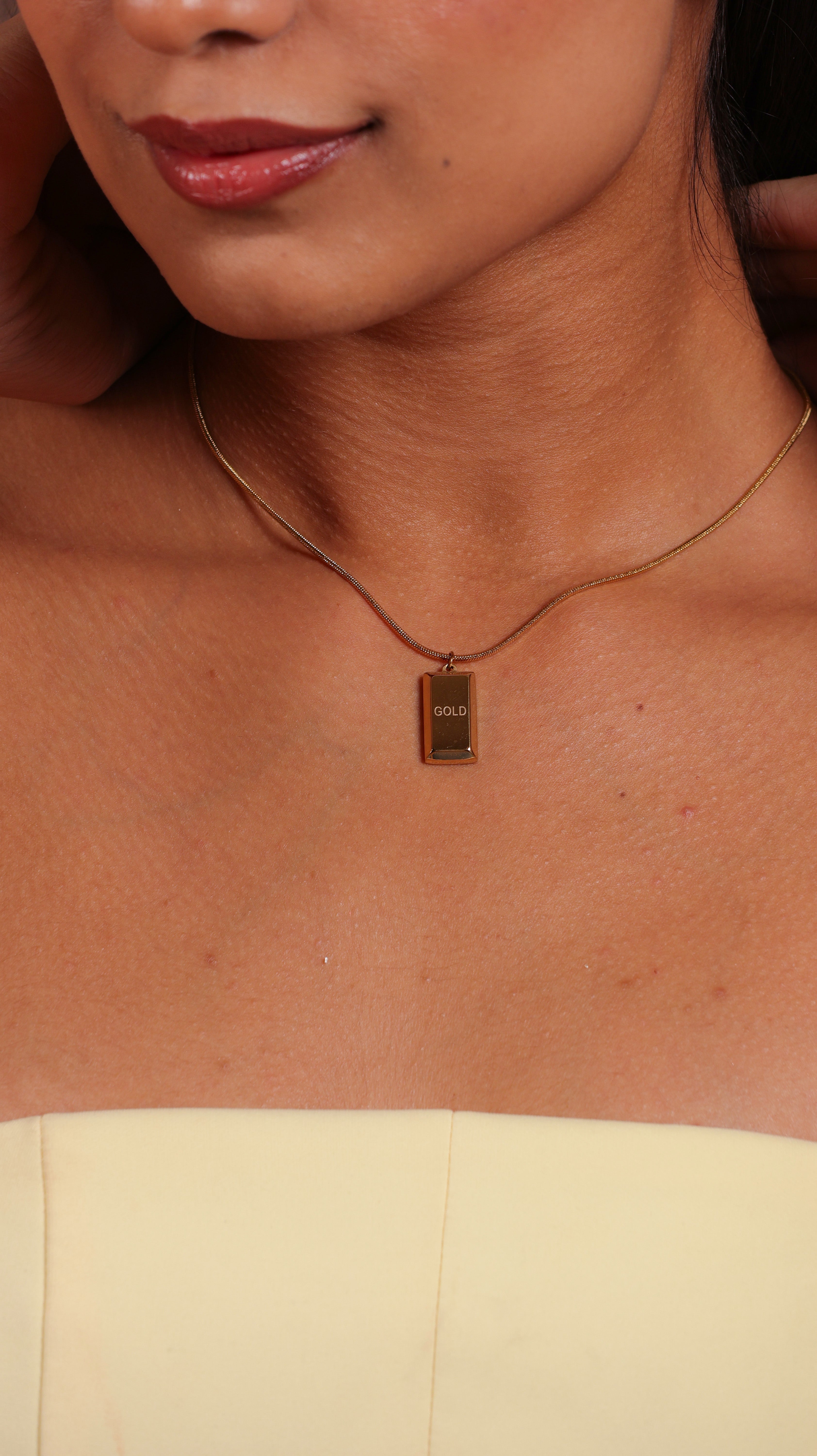 Gold biscuit pendant